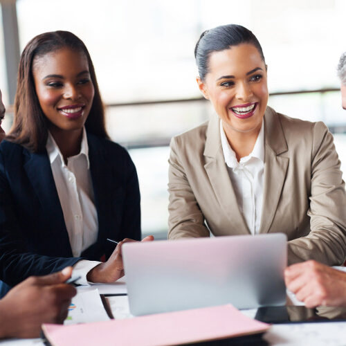 cheerful business people in a meeting at office